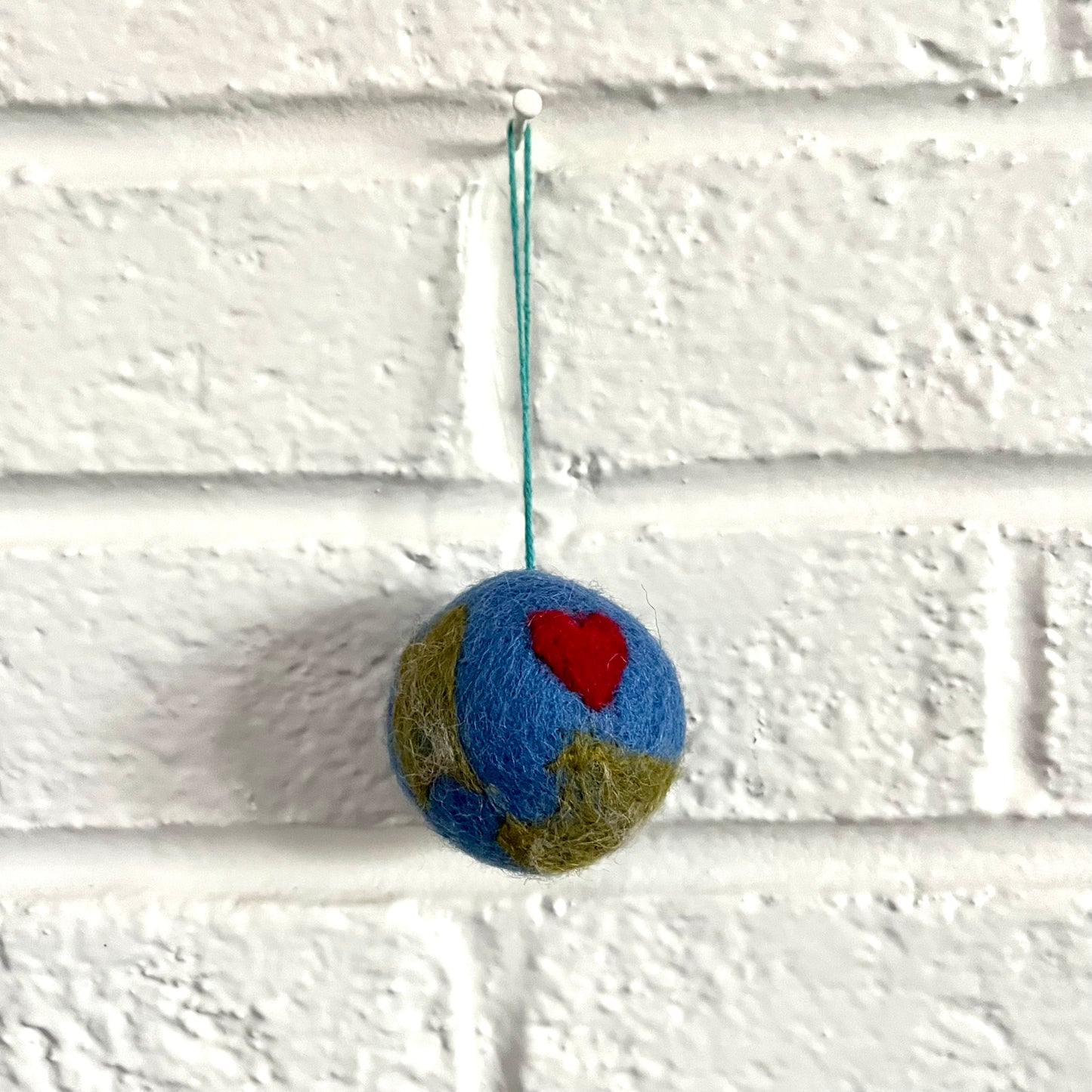 one little world ornament (low stock)