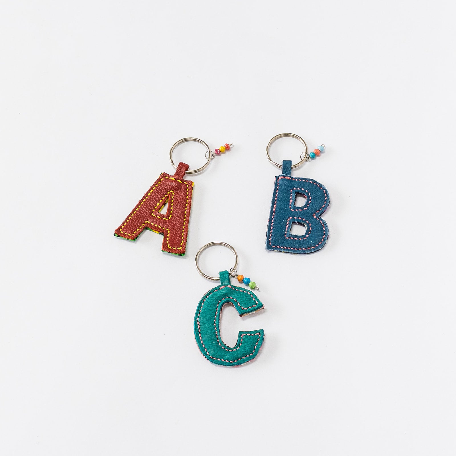 kitenge + leather initial keychains