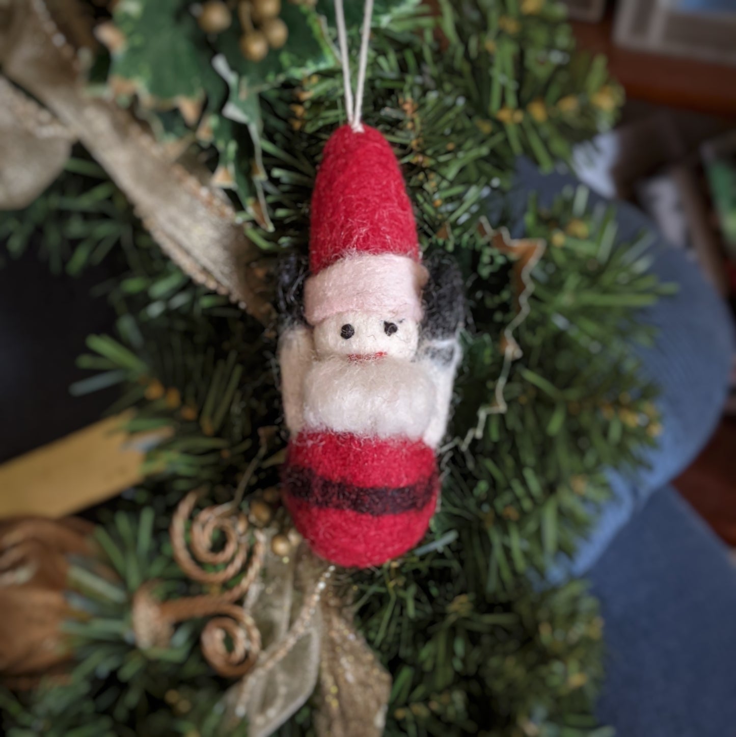 handcrafted felt santa ornament